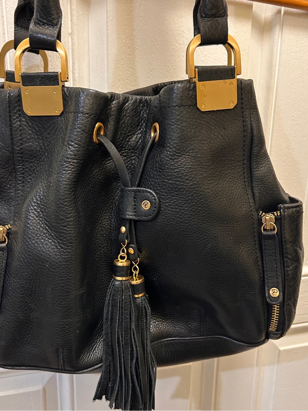 Black Shoulder Tote with Tassel and Gold Hardware